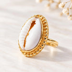 Gold cowrie shell ring