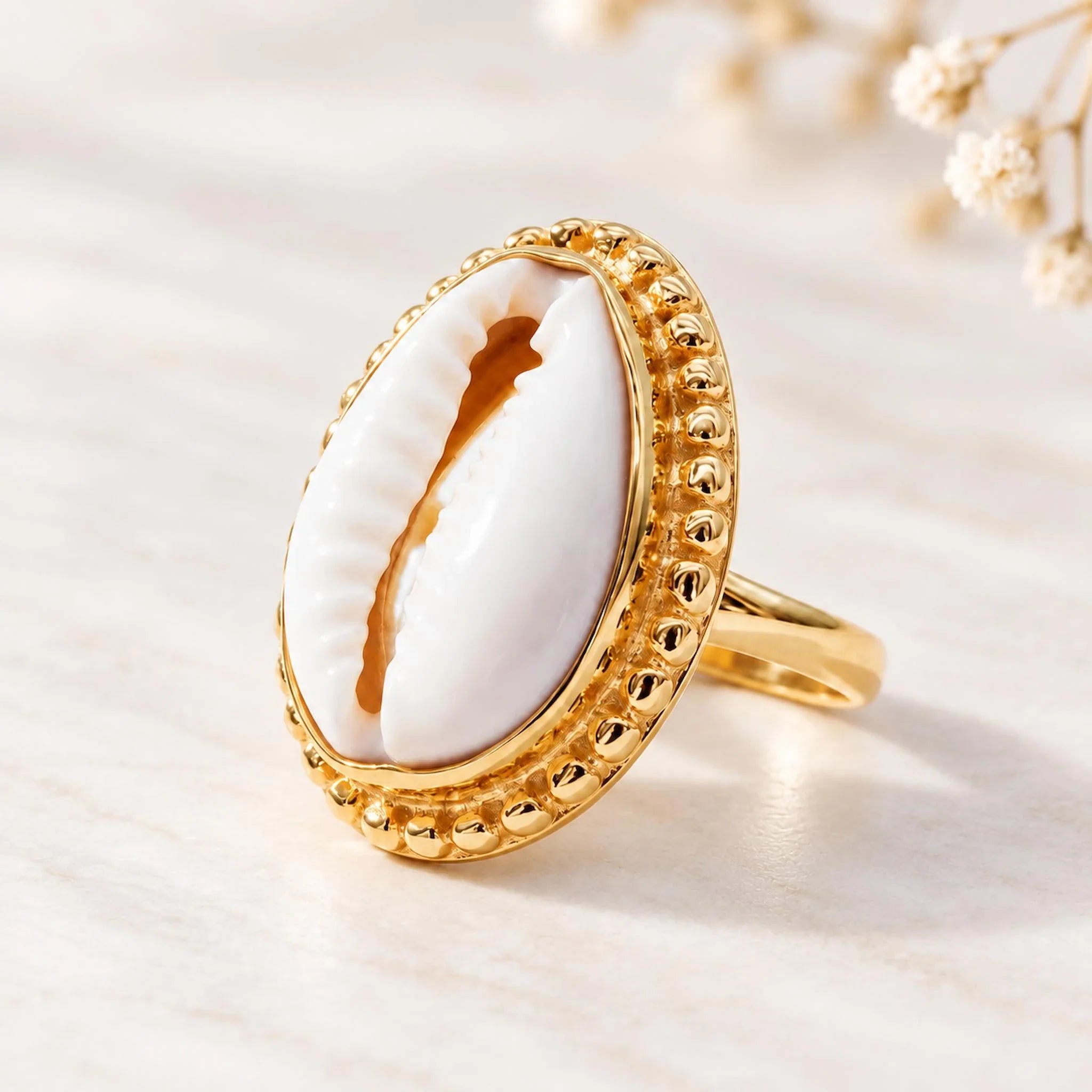Gold cowrie shell ring