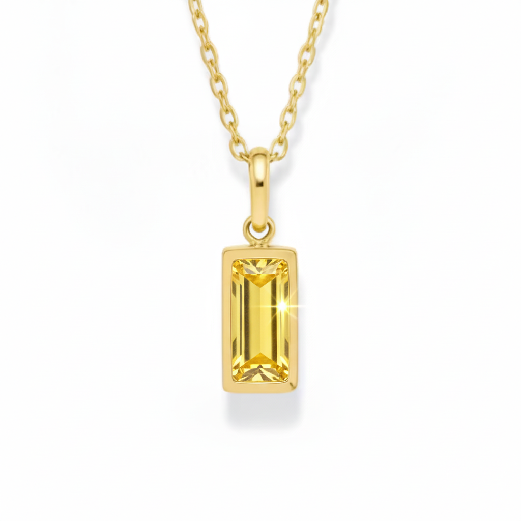 Gold pendant necklace with a rectangular gemstone on a white background