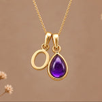Gold initial O necklace with a natural February amethyst
