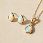 Gold October Birthstone opal Jewellery set including pear-shaped opal stud earrings and opal pendant necklace