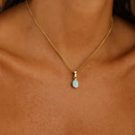 Gold October birthstone opal necklace worn on the neck