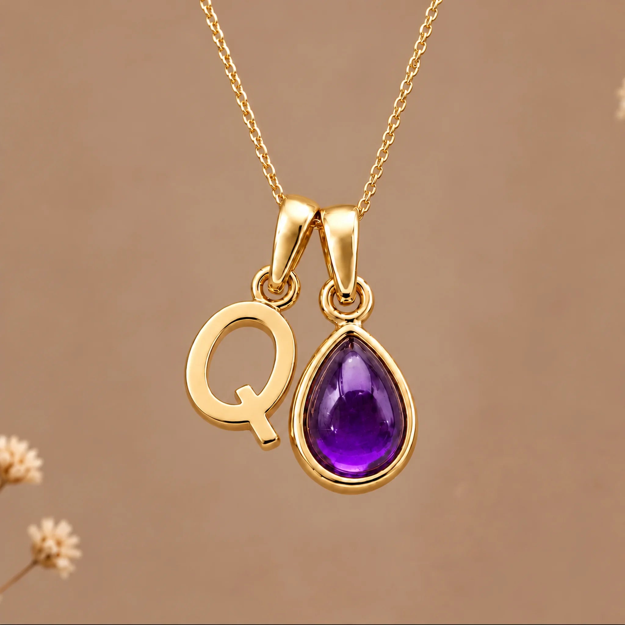 Gold initial Q necklace with a natural February amethyst