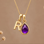 Gold initial R necklace with a natural February amethyst