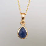 Gold september birthstone necklace with a pear-shaped sapphire gemstone pendant - september birthday jewellery gift