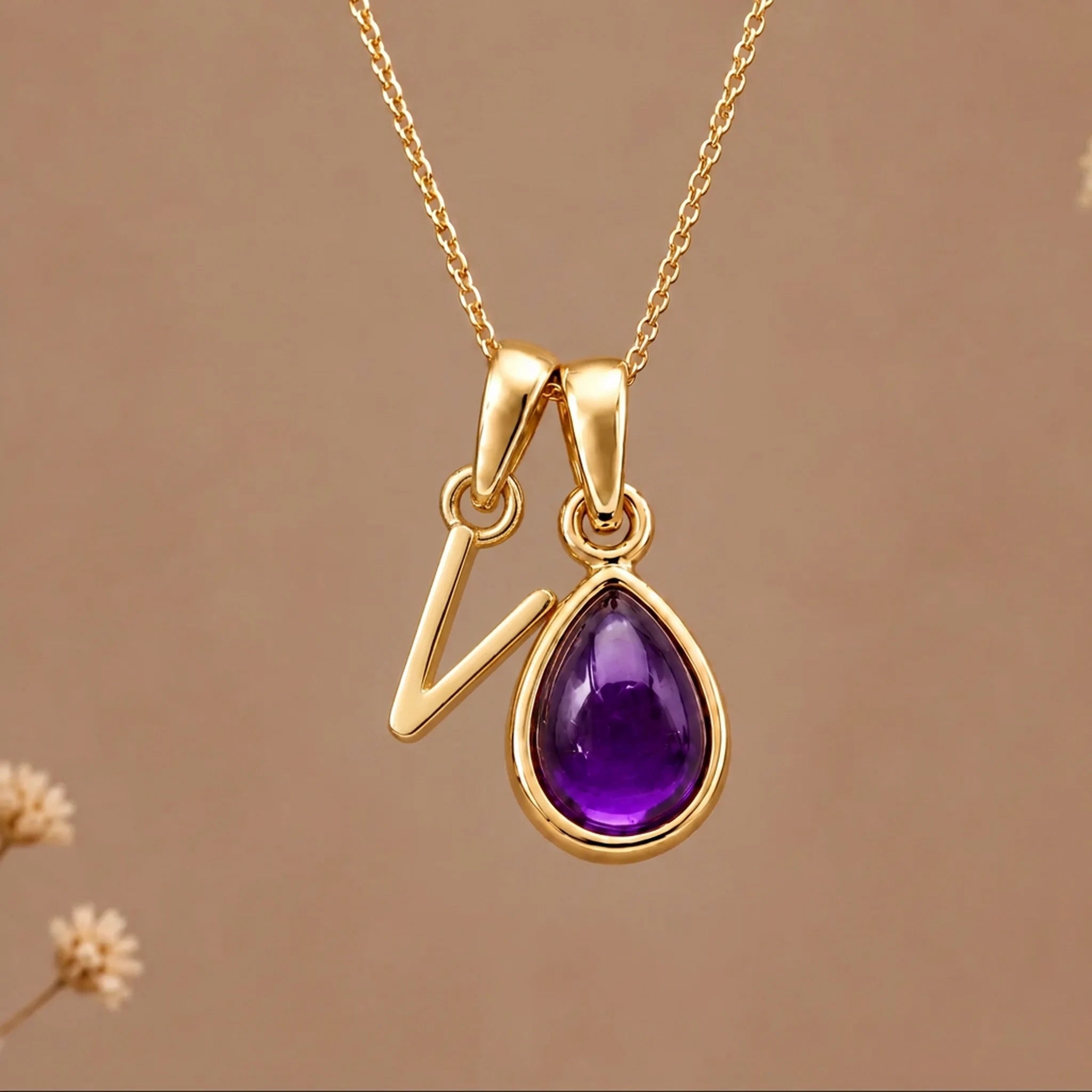Gold initial V necklace with a natural February amethyst