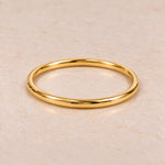4 mm round Gold Waterproof Classic Bangle Bracelet, 61 mm internal diameter, 18k gold plated stainless steel on pale stone