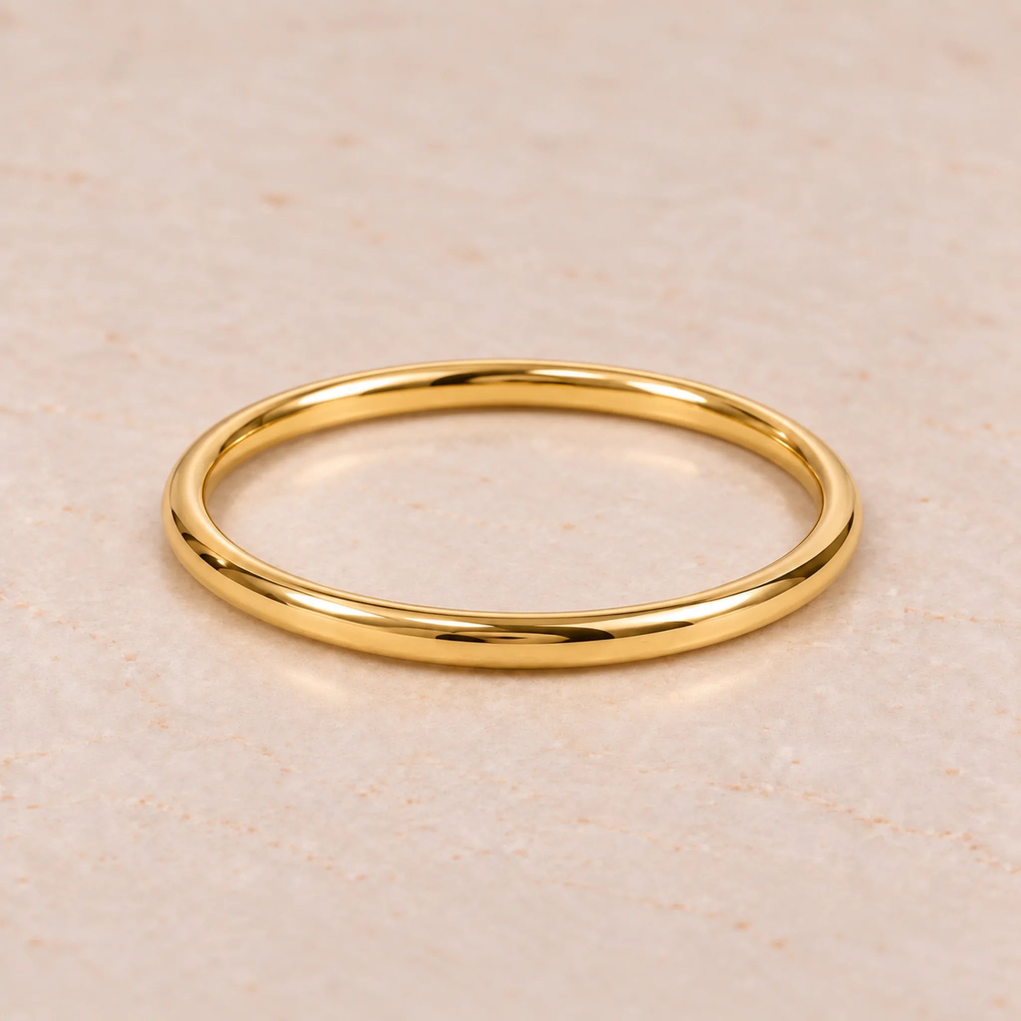 4 mm round Gold Waterproof Classic Bangle Bracelet, 61 mm internal diameter, 18k gold plated stainless steel on pale stone