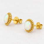 Gold white opal stud earrings showing post and 925 butterfly back
