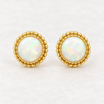 Gold white opal stud earrings, front view