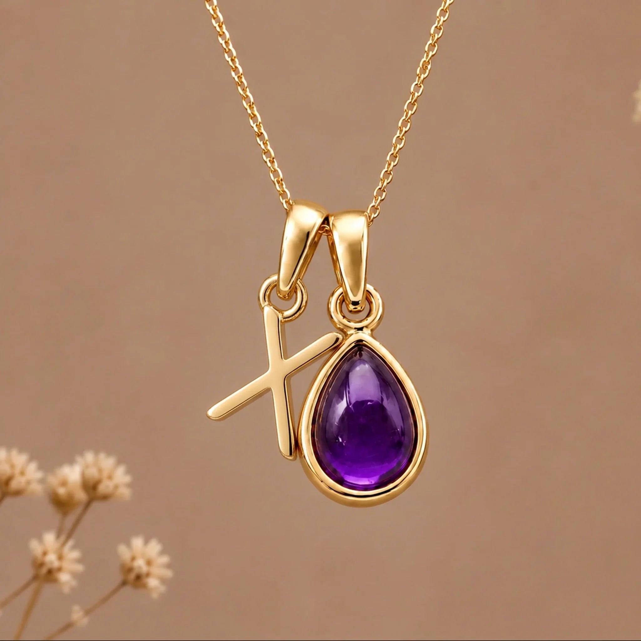 Gold initial X necklace with a natural February amethyst