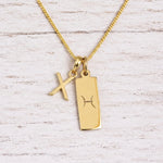 gold initial X pendant and pisces zodiac star sign pendant on a fine gold chain