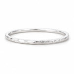 Sterling Silver hammered stacker ring on a white background