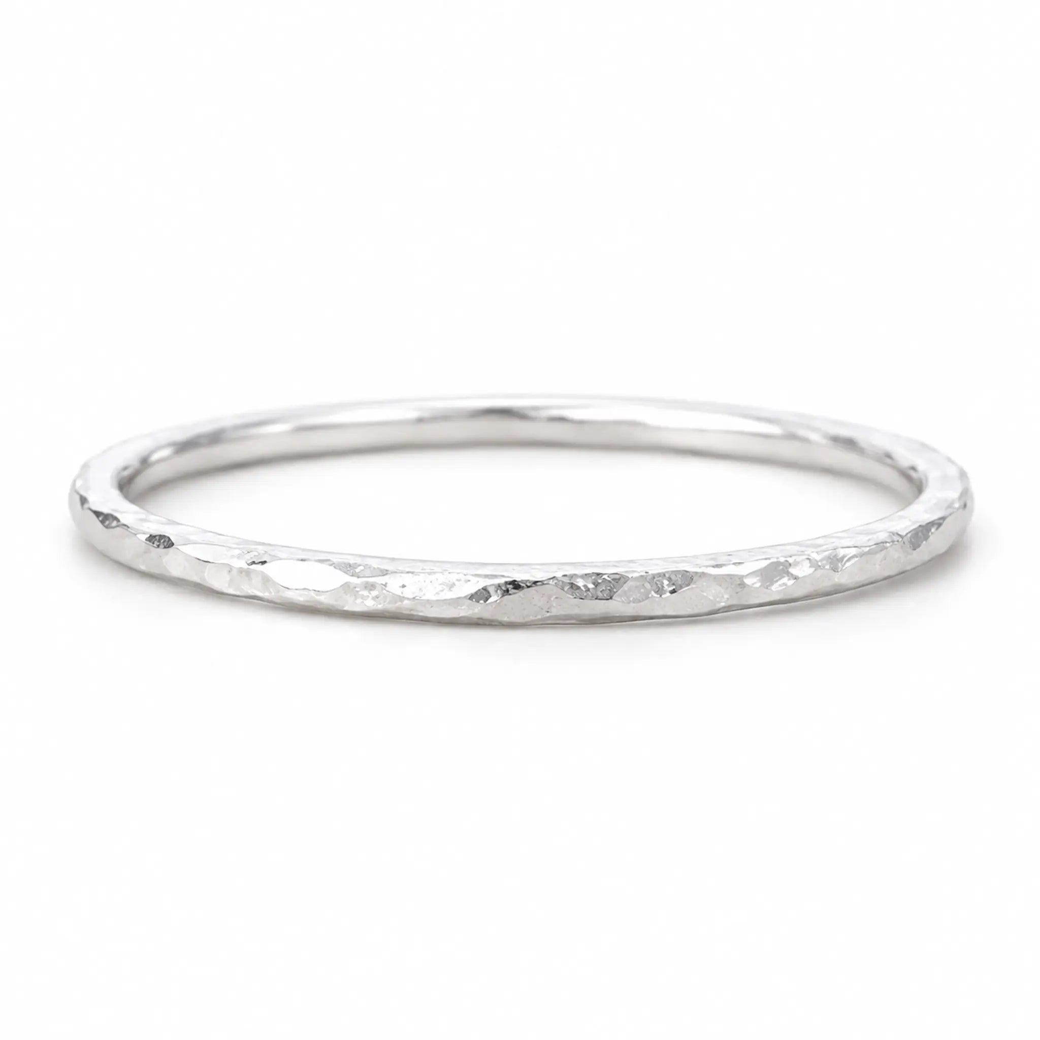 Sterling Silver hammered stacker ring on a white background