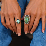 Woman wearing sterling silver Navajo turquoise rings