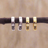 indie and harper silver and gold dainty huggie style earrings with beautiful star detailing and cubic zirconia