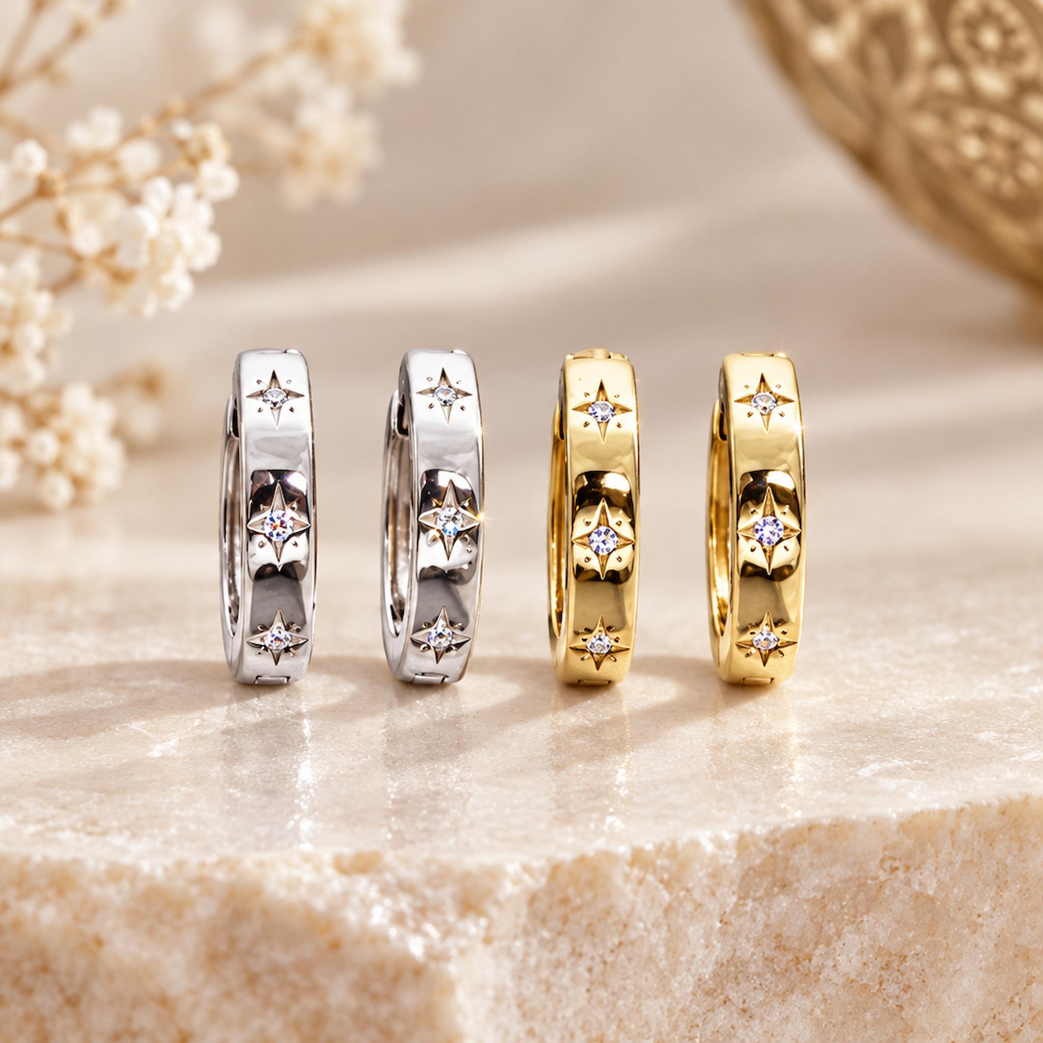 silver and gold dainty huggie style hoop earrings with beautiful star detailing and cubic zirconia