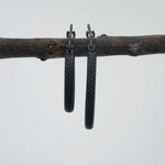indie and harper waterproof black hoop earrings in medium and large sizes