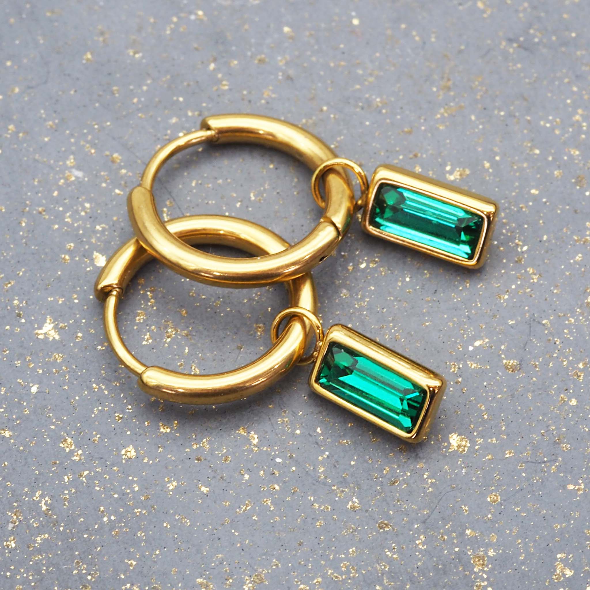 indie and harper dainty emerald green and gold huggie earrings