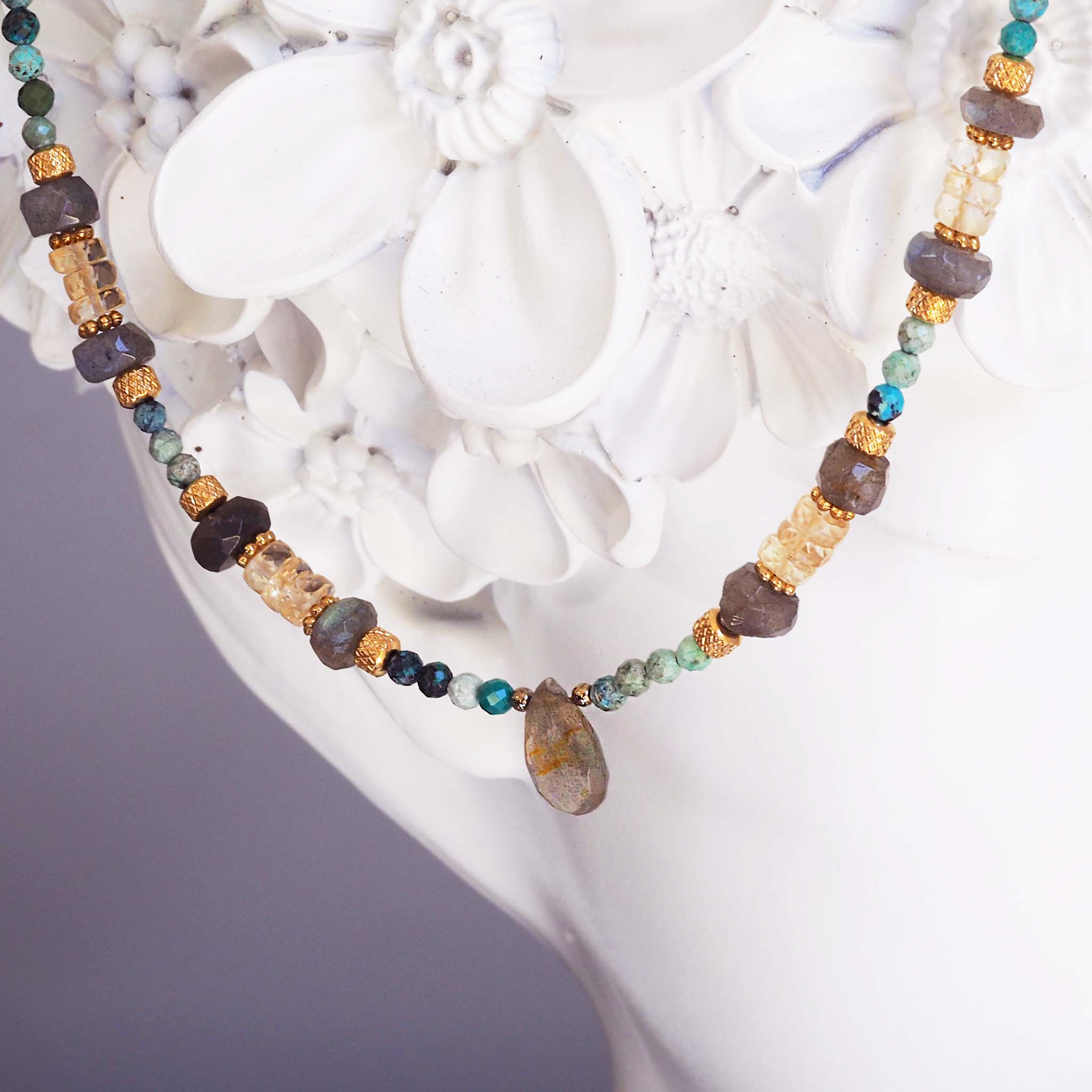 bohemian necklace by online jewellery brand indie and harper made with gold detailing and natural turquoise, labradorite and citrine gemstone beads.