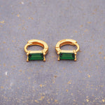 indie and harper dainty gold and emerald green huggie earrings 