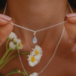 Indie and Harper dainty Sterling silver tear drop moonstone necklace being worn