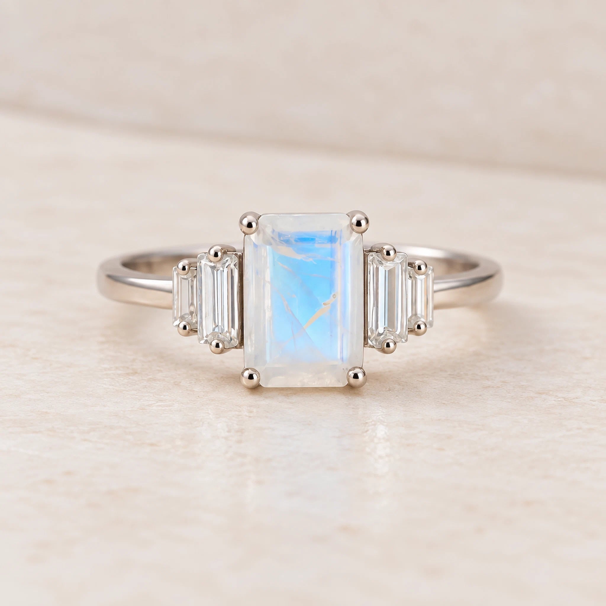 Silver Moonstone ring with a rectangular gemstone on a light background