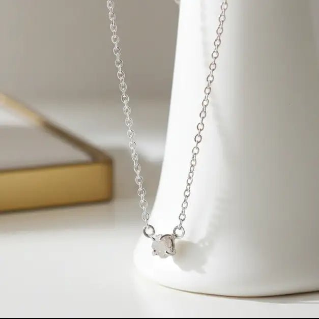Glacier raw diamond necklace by Indie and Harper in sterling silver, styled on ceramic vase