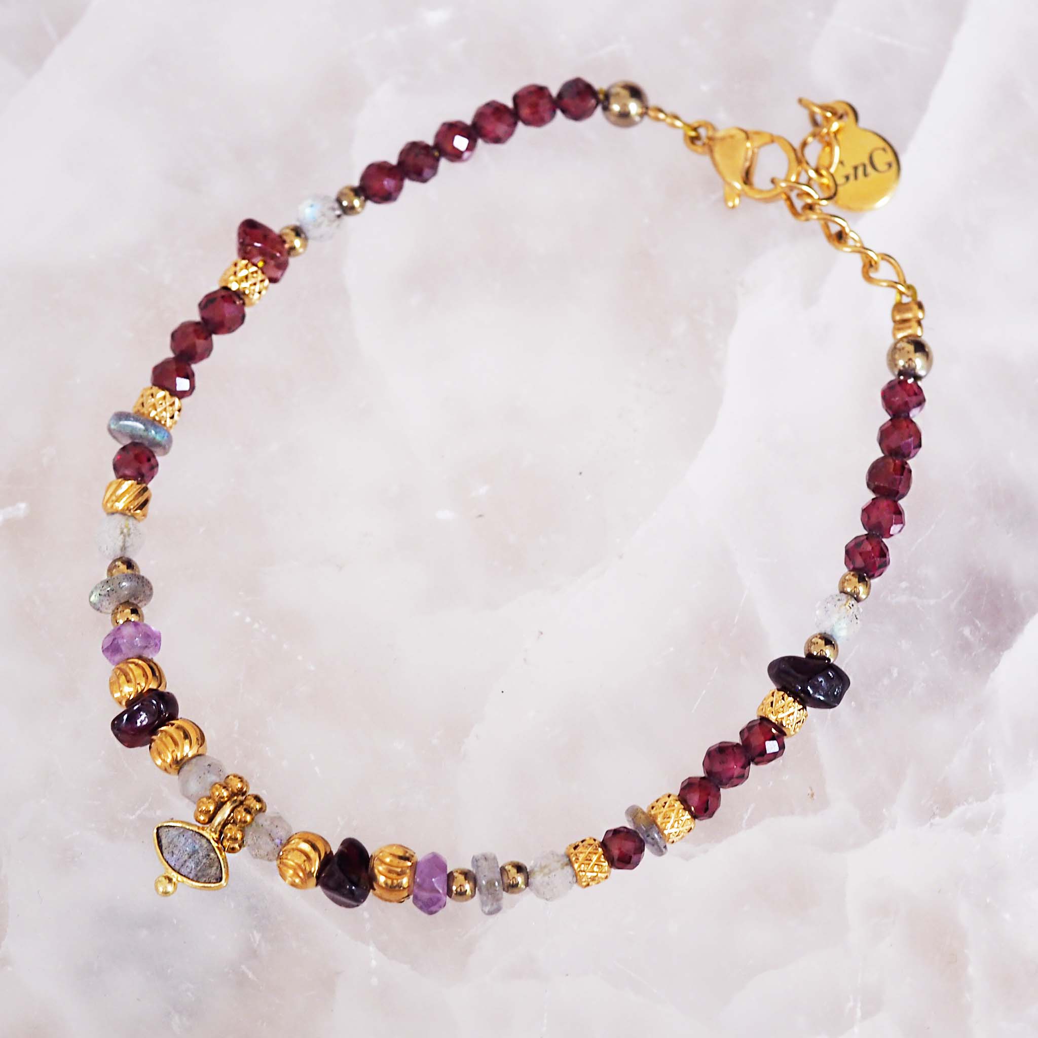 indie and harper natural garnet, amethyst and labradorite beaded bracelet with gold detailing