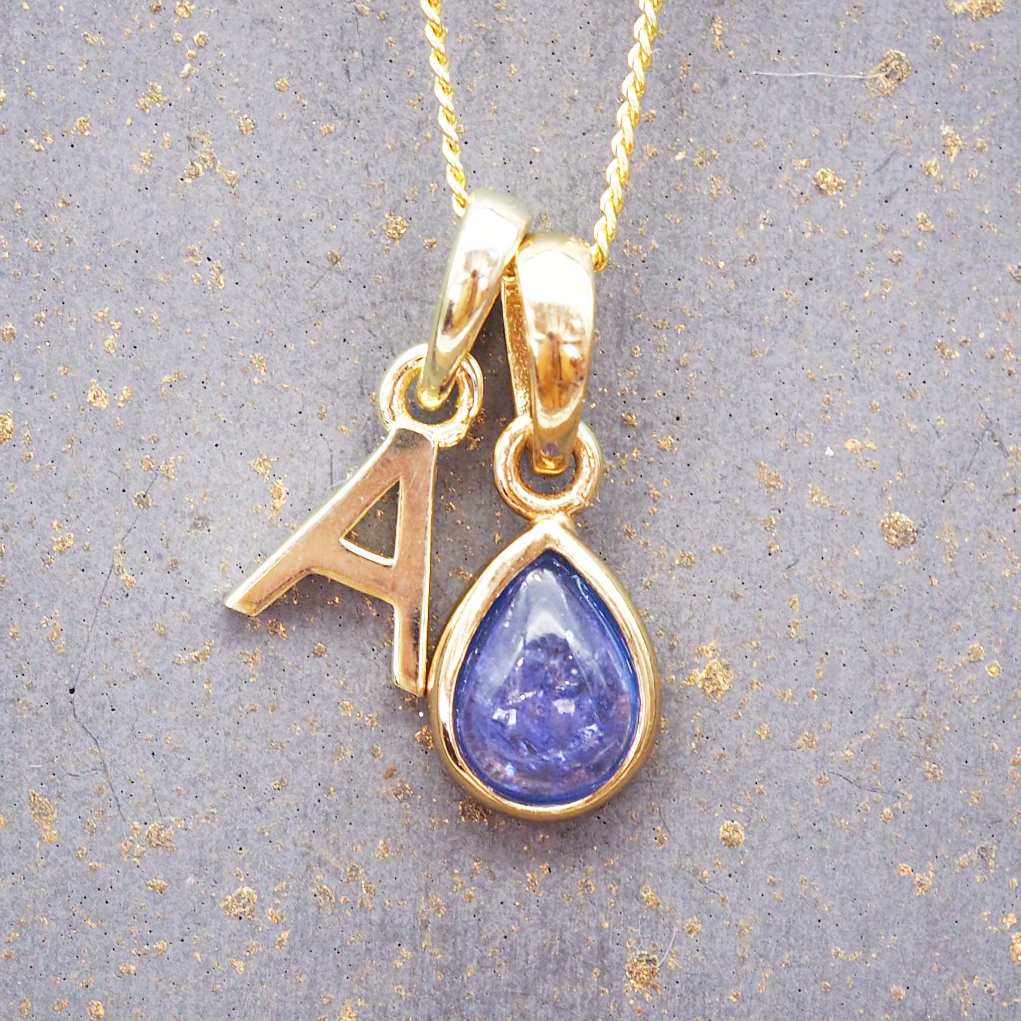 Gold Initial A Pendant and December birthstone tanzanite Necklace by indie and harper australia