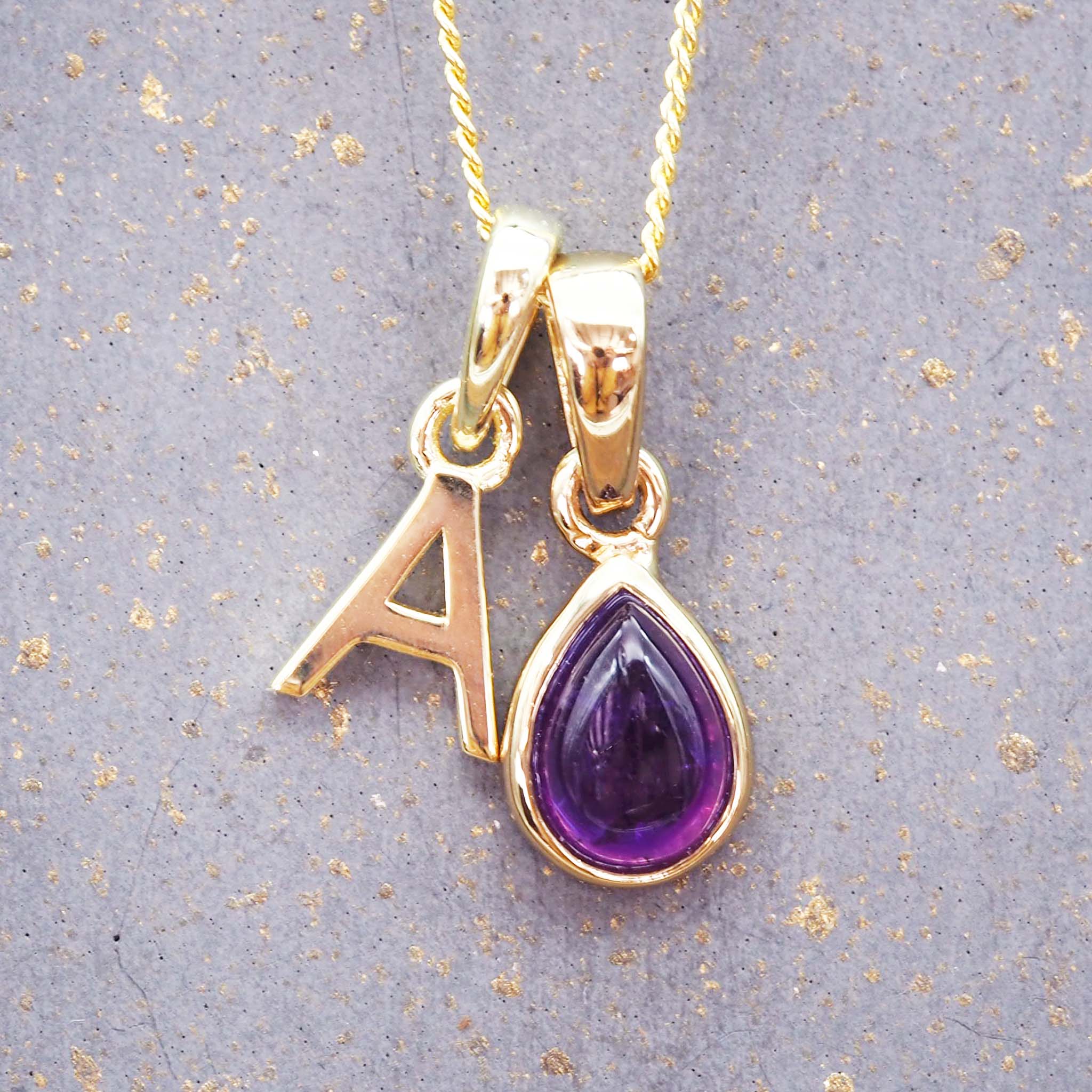 indie and harper gold initial pendant and february birthstone amethyst necklace