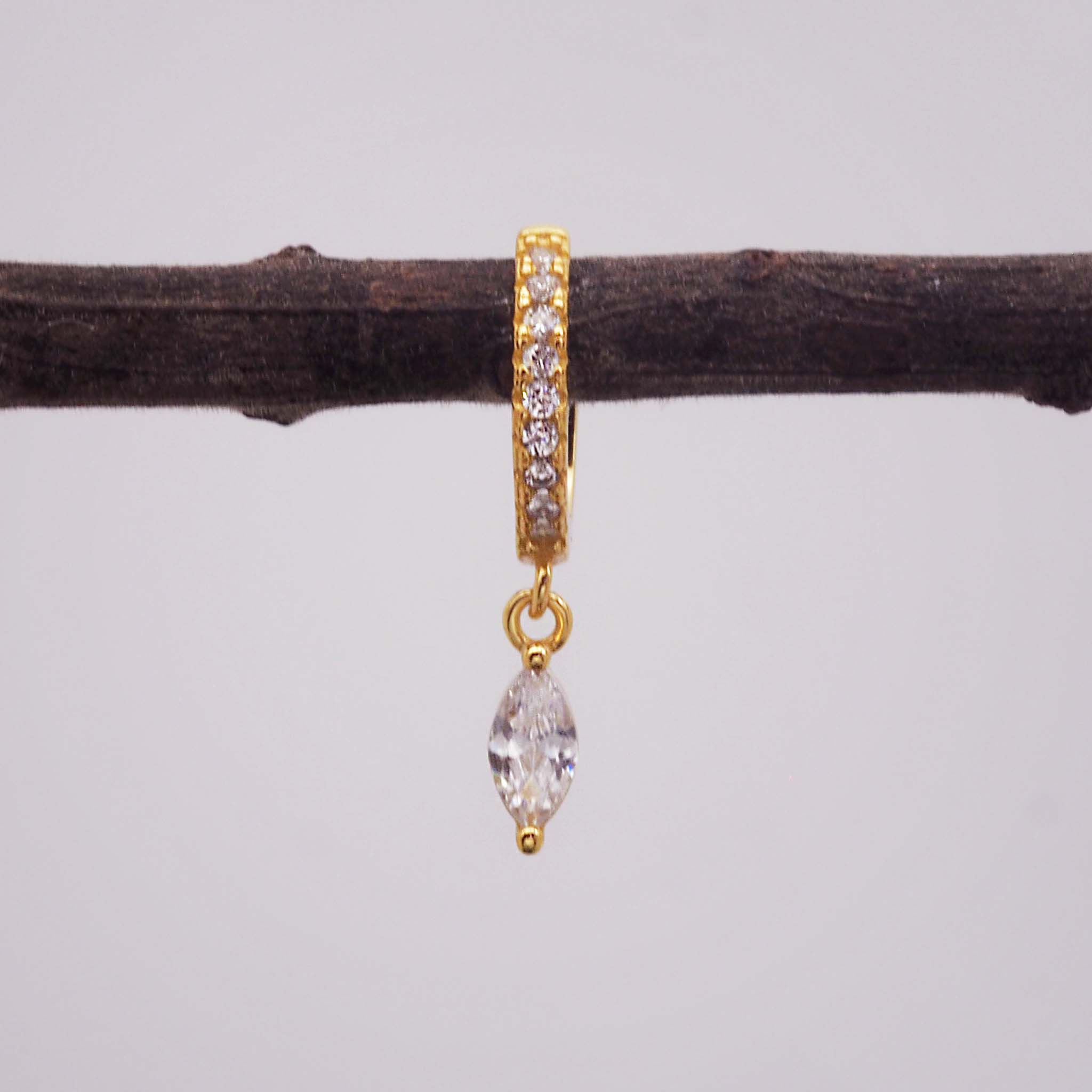 indie and harper gold huggie style earring with cubic zirconia