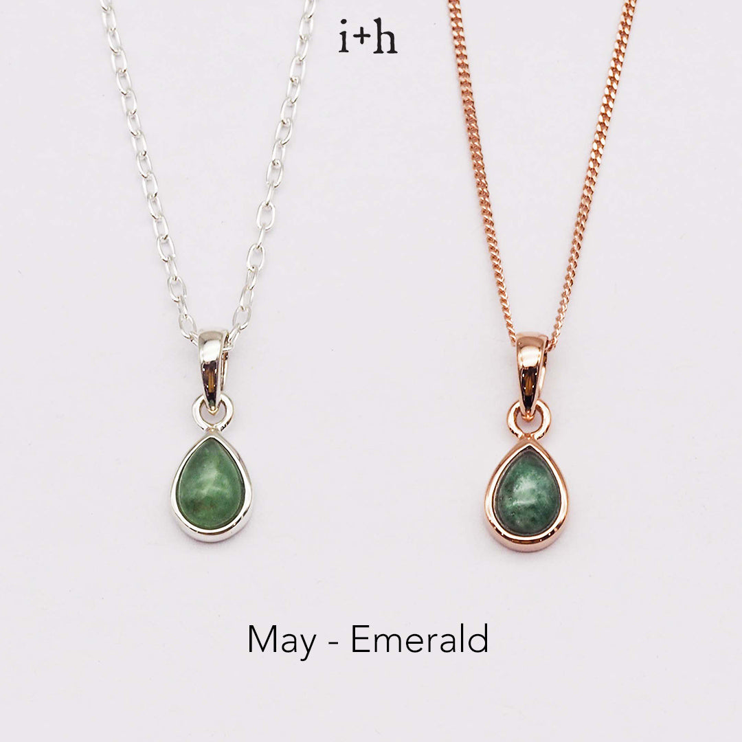 Two necklaces with green teardrop pendants on a white background, labeled 'May - Emerald'.