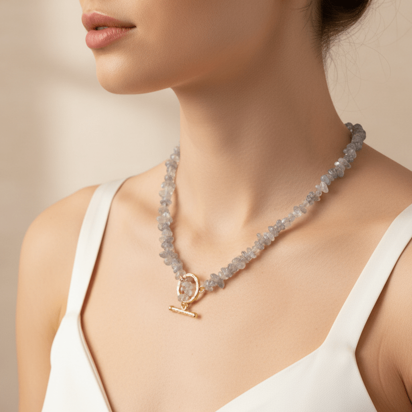 gold lariat style beaded necklace with natural gemstones being worn