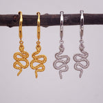 indie and harper serpent charm hoop earrings in silver and gold