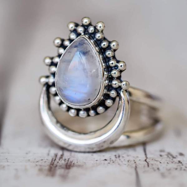 sterling Silver moonstone ring with a teardrop-shaped moonstone on a marble surface - moonstone jewellery australia by indie and harper