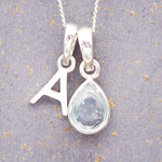 sterling silver initial a pendant and november birthstone topaz necklace by indie and harper australia