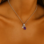 sterling silver initial and february birthstone amethyst necklace being worn - by indie and harper australia