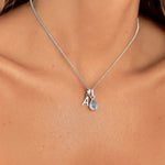Sterling silver initial and November birthstone topaz necklace being worn - indie and Harper australia