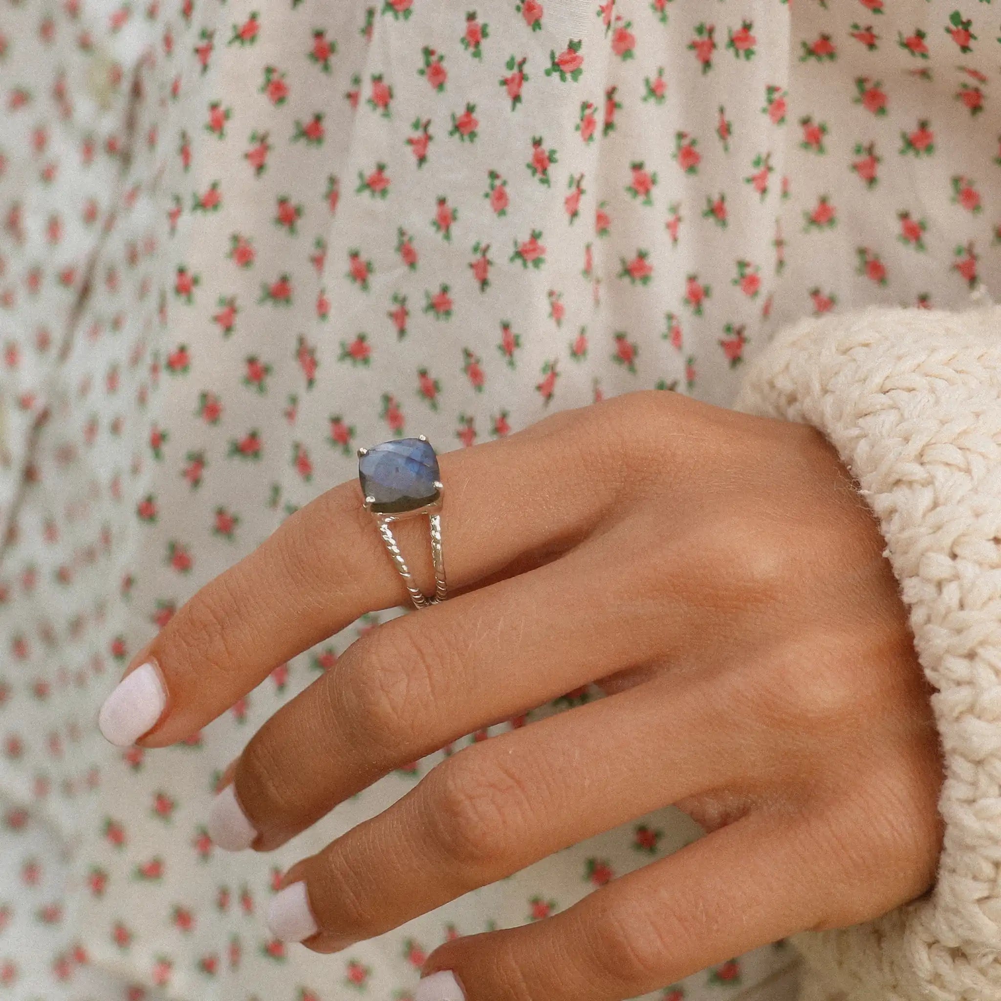 woman's hand wearing silver labradorite ring by indie and harper Australia 