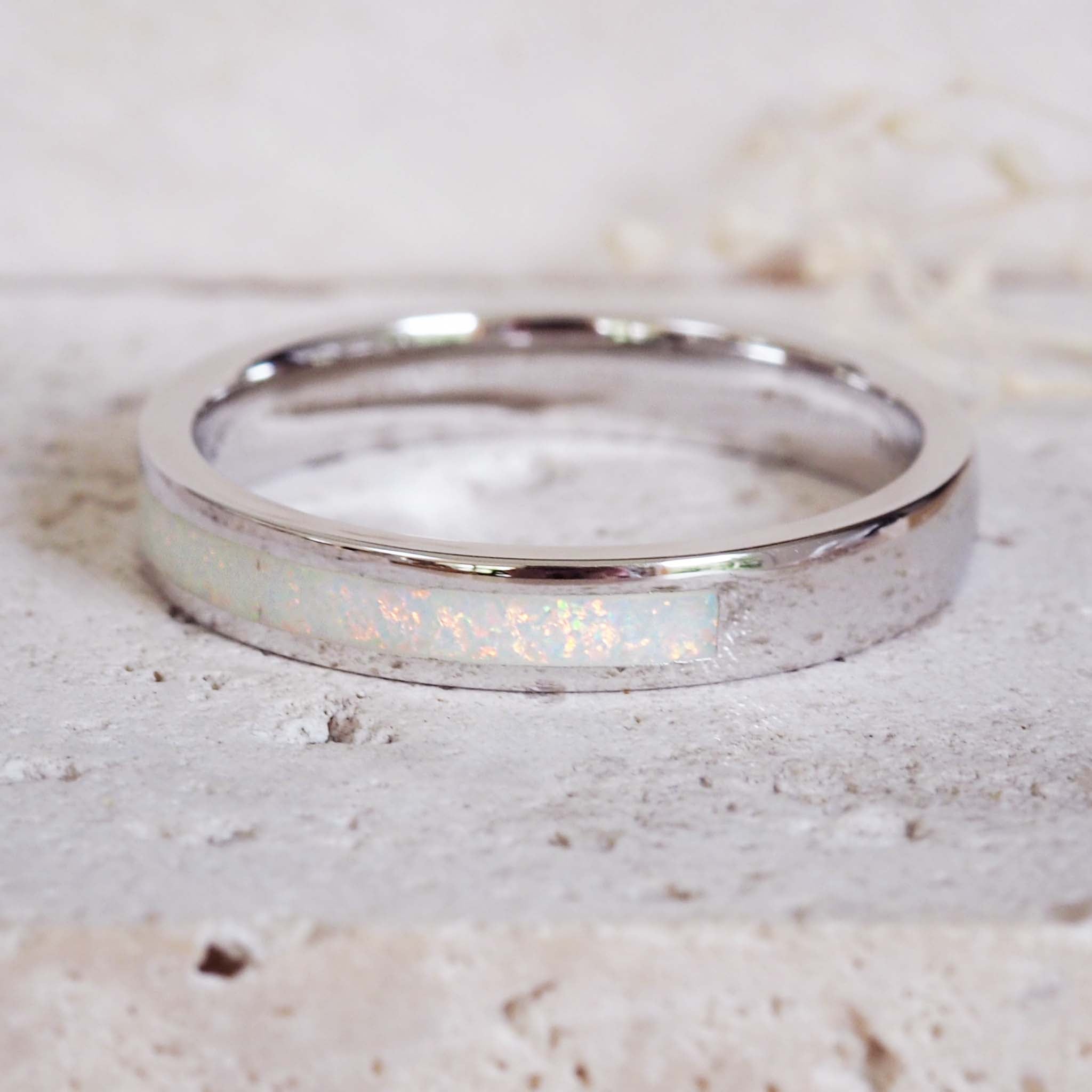 white opal band ring made with white synthetic opal and sterling silver