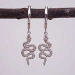 indie and harper silver huggie earrings with beautiful serpent charm