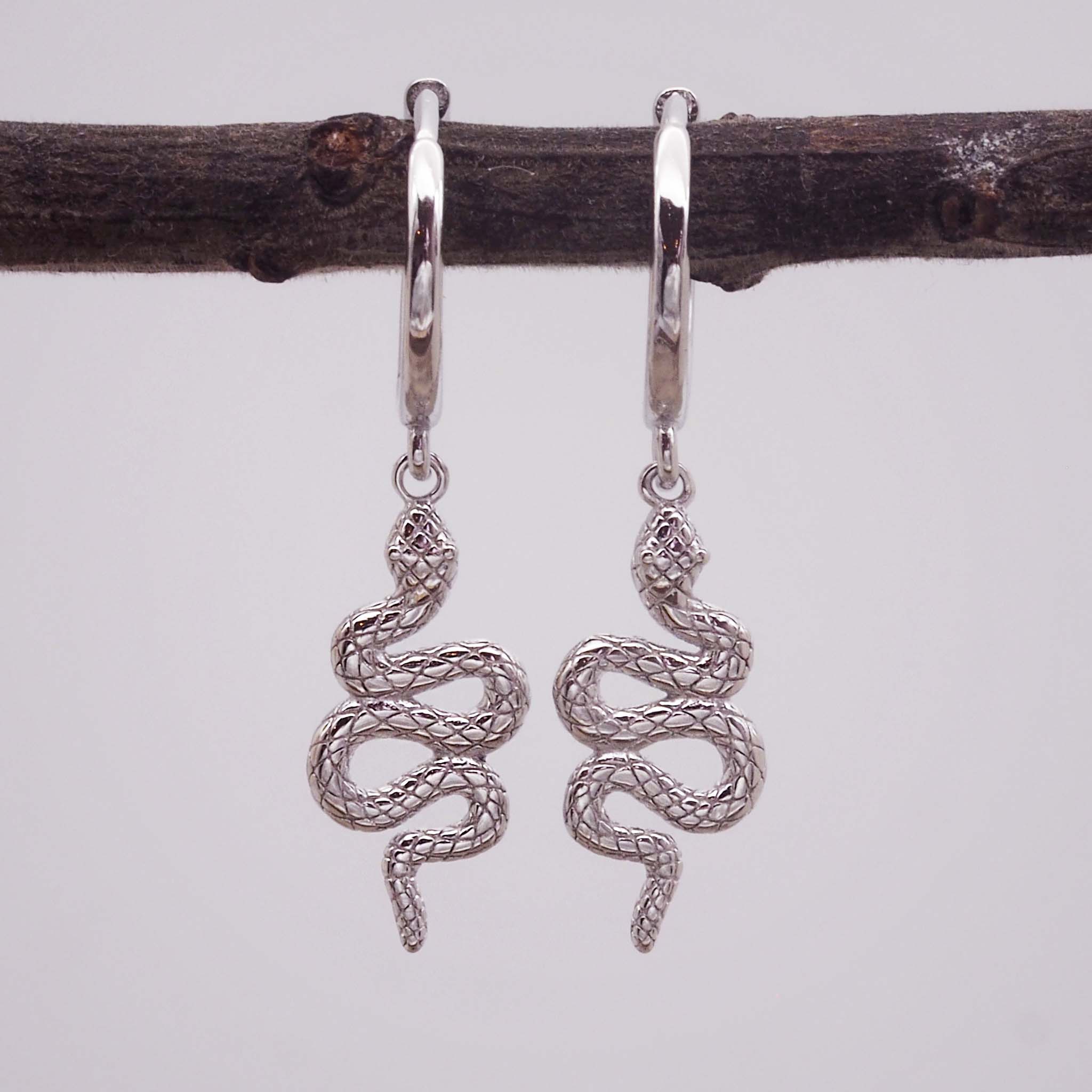 indie and harper silver huggie earrings with beautiful serpent charm