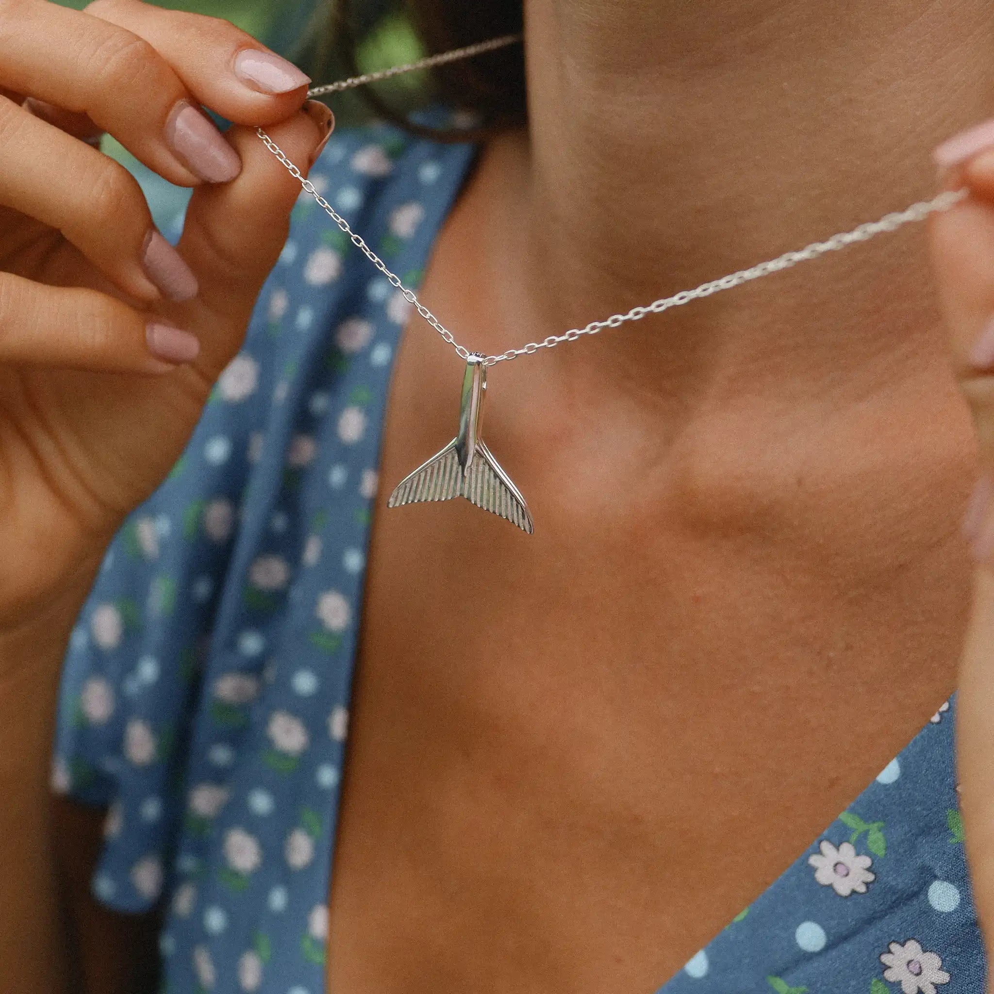 woman in blue dress wearing silver whale tail necklace by indie and harper Australia 