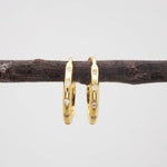 indie and harper gold Hoop earrings with cubic zirconias