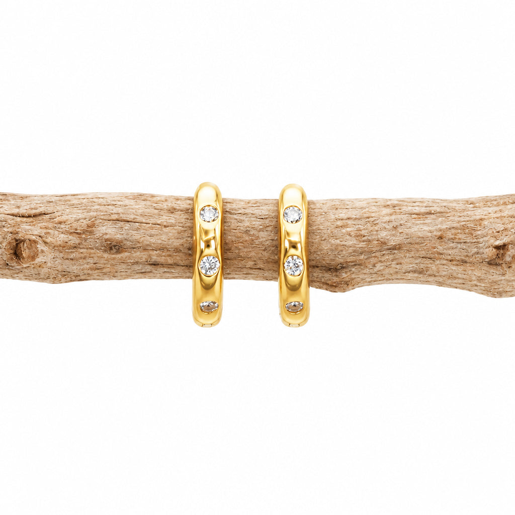 Gold CZ stacking hoop earring showing the spaced cubic zirconia