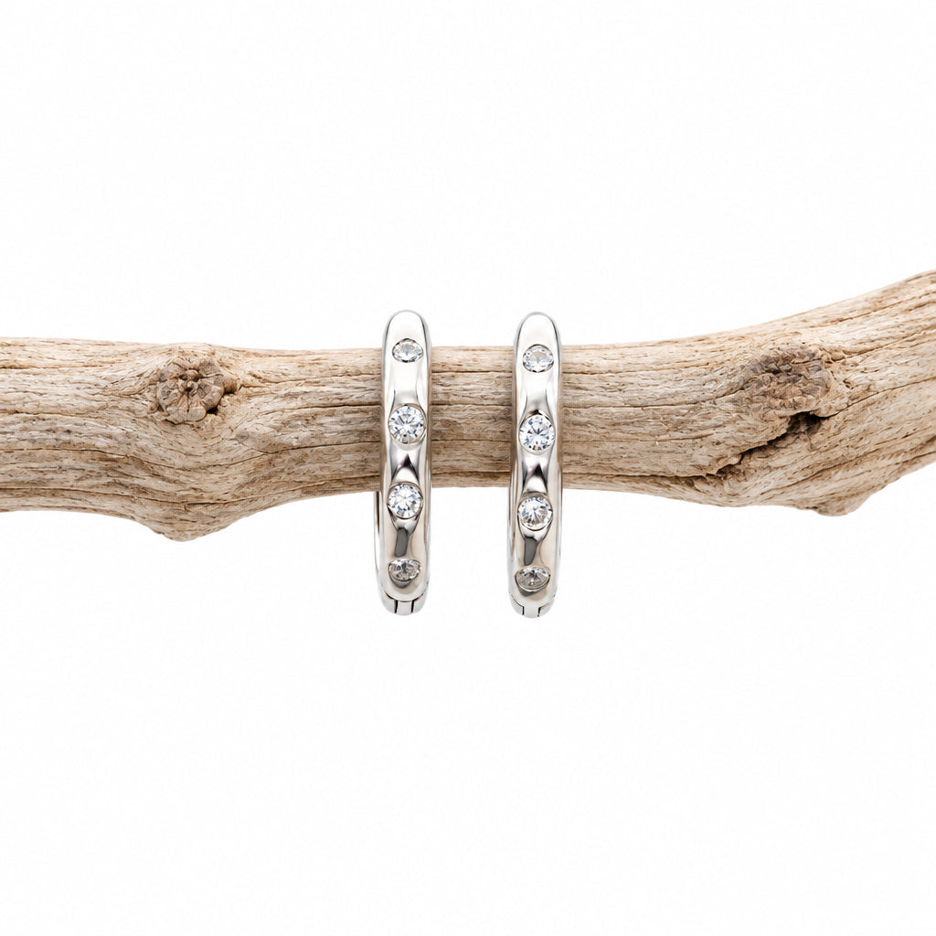 Silver CZ stacking hoop earring showing the spaced cubic zirconia