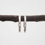 indie and harper silver Hoop earrings with cubic zirconias