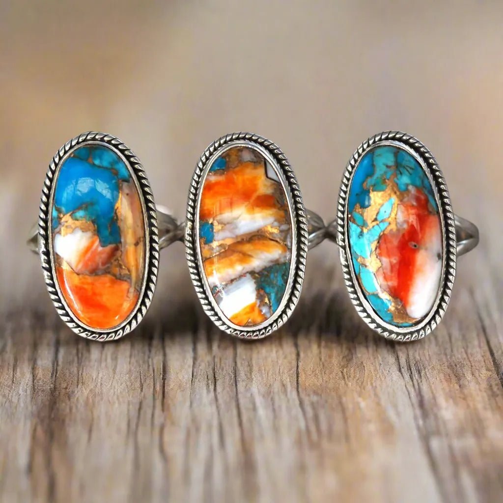 three sterling silver spiny oyster turquoise rings on a wooden table - boho jewellery australia by indie and harper