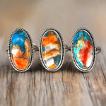 three sterling silver spiny oyster turquoise rings on a wooden table - boho jewellery australia by indie and harper
